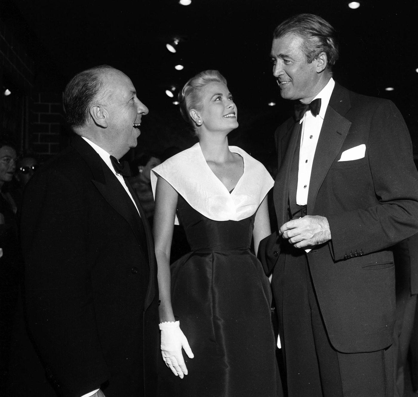 Alfred Hitchcock with Grace Kelly and Jimmy Stewart at the premier of "Rear Window"
