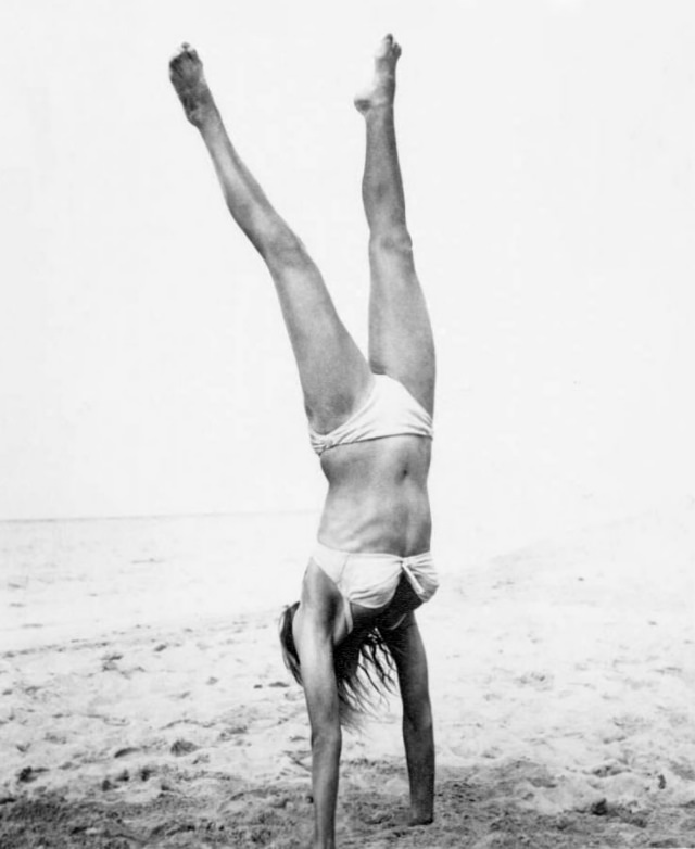 A Hands-On Lesson: Sean Connery Helps Ursula Andress Perfect a Handstand