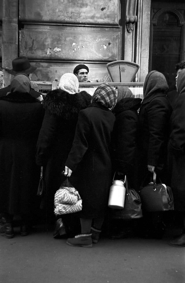 Line of people at a market.