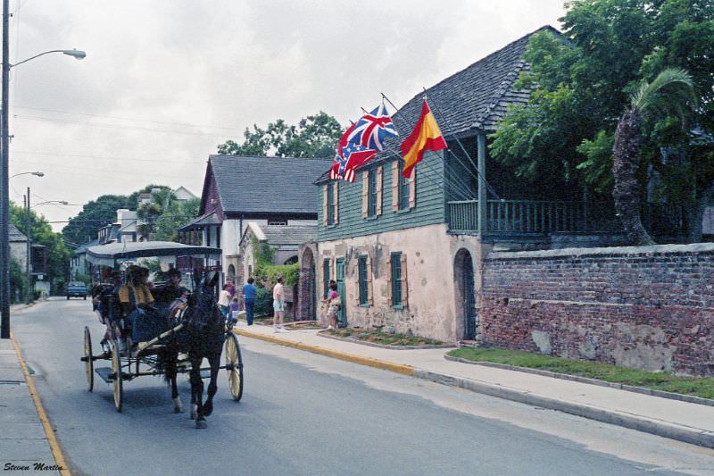 Carriage passing Gonzalez-Alvarez House, the oldest in St. Augustine and in Florida, St. Augustine, 1986