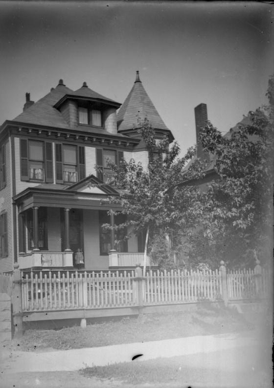 Child Standing on the Porch of a Large House, 1900