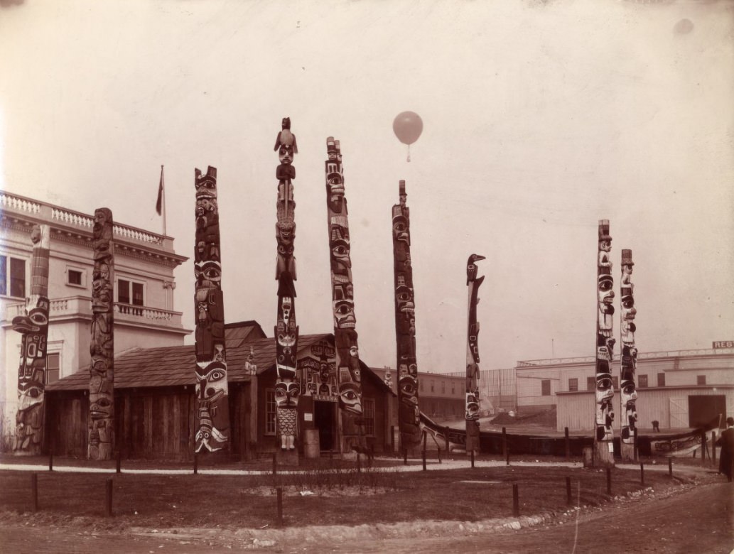 The totem poles around the Alaska house at the 1904 World's Fair in St. Louis.