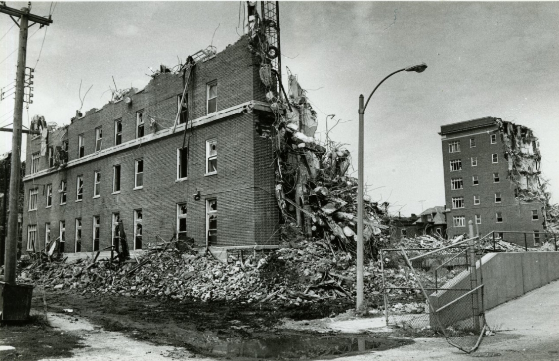 Demolition of building at Lafayette and Grattan, west of City Hospital, 1984