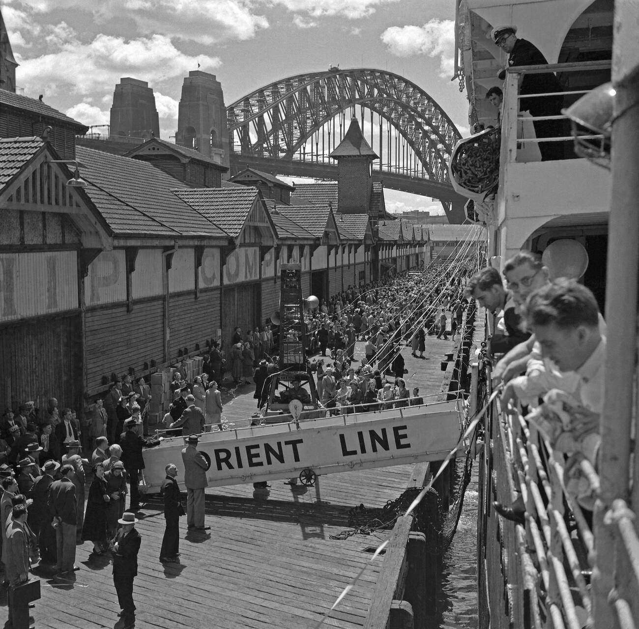 Orient Line passenger ship about to set sail and leave the Overseas Passenger Terminal at Circular Quay, Sydney Harbour, 1960s