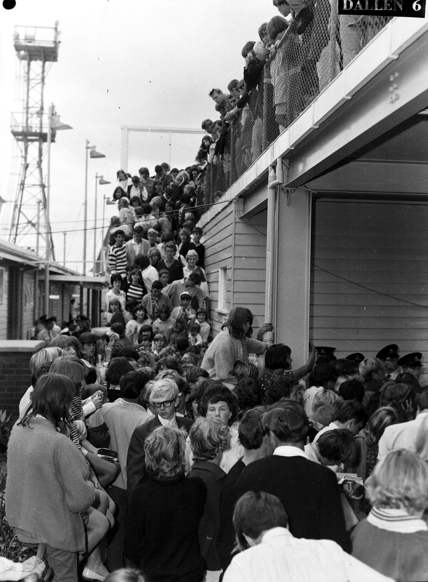 Fans await the arrival of the Rolling Stones at Mascot Airport, Sydney, January 21 1965.