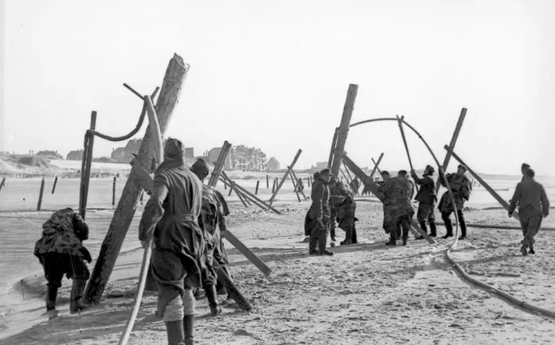 German soldiers placing landing craft obstructions, 1943.