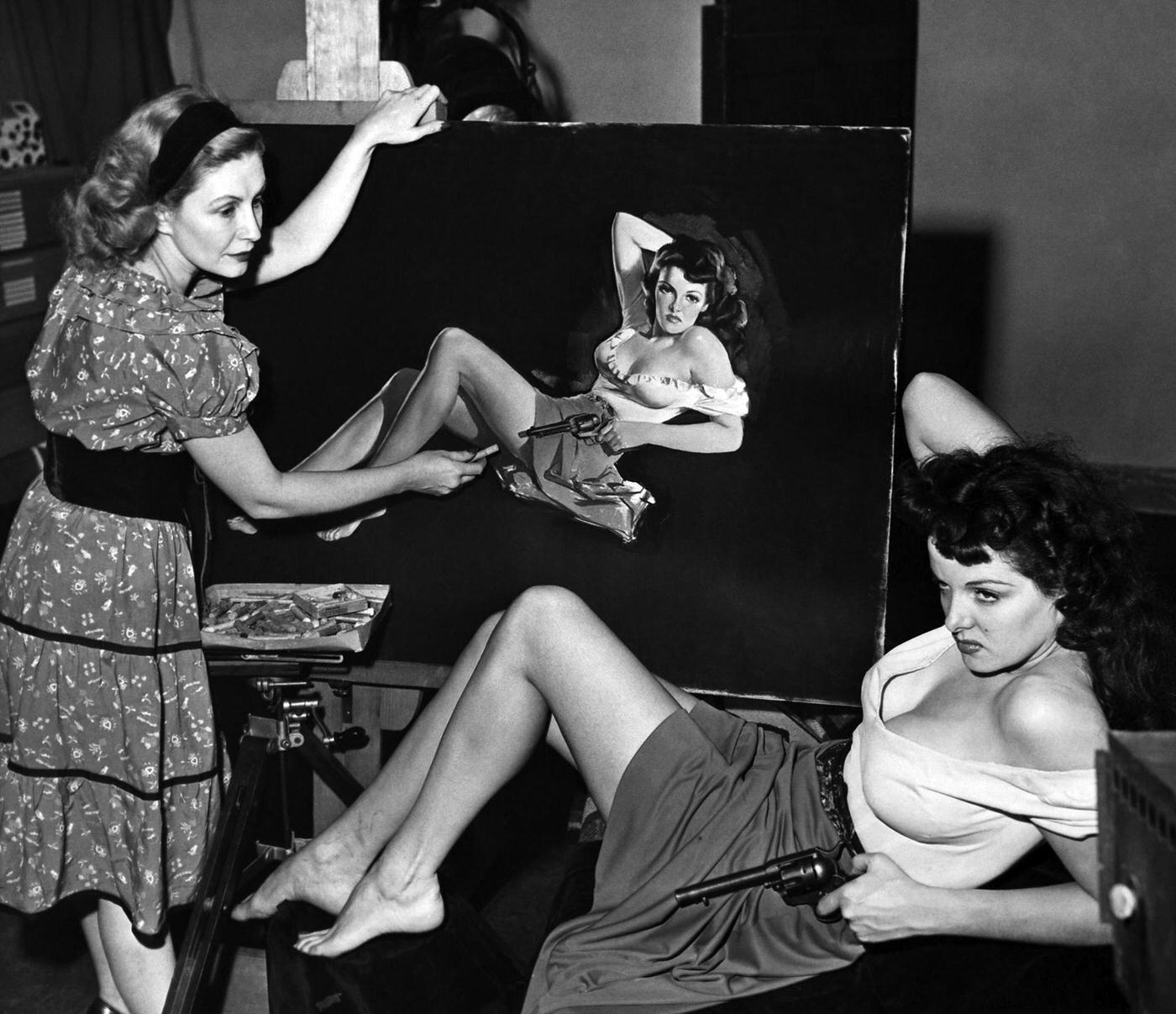 Jane Russell posses for a painting of a portrait session for the movie "The Outlaw" 1943