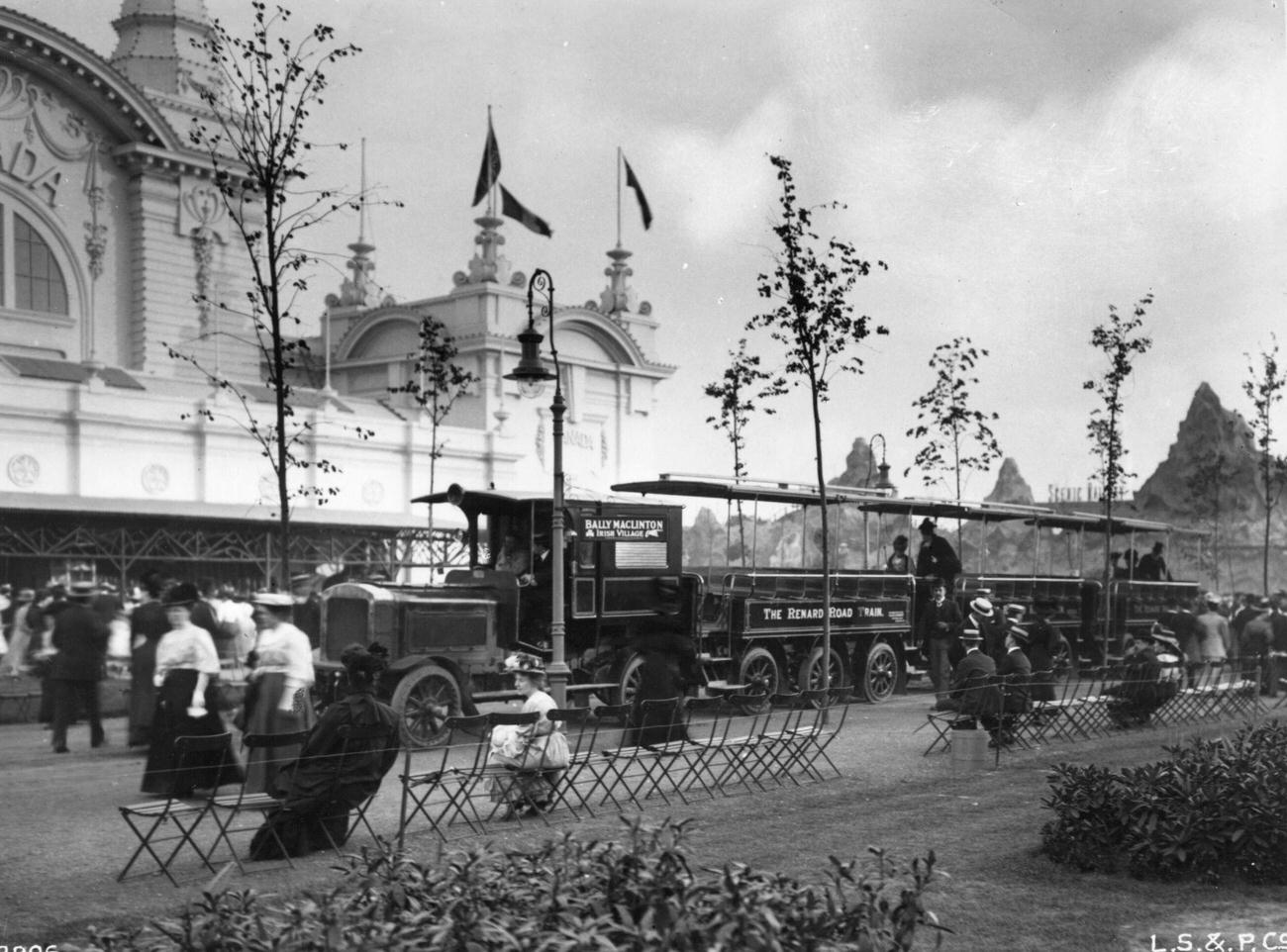 Scene at the 1908 Franco-British Exhibition with a locomotive in the foreground.