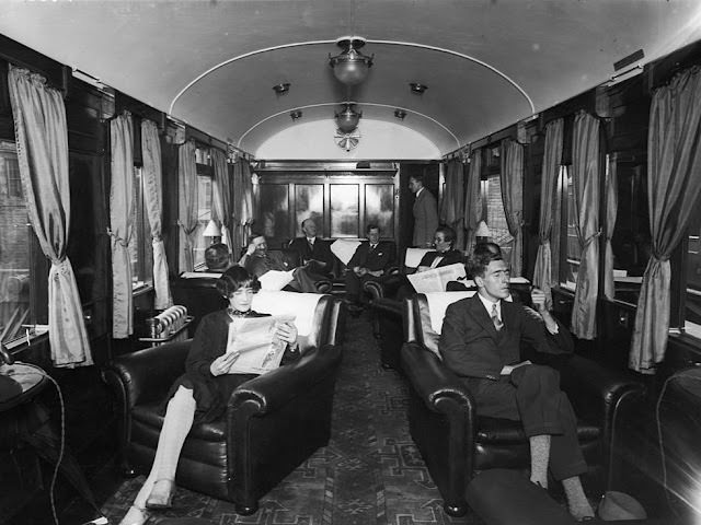 Furnished like living rooms, they came complete with armchairs, drapes, and carpeting. The luxurious first class lounge on board a London Midland and Scottish Royal Scot train.