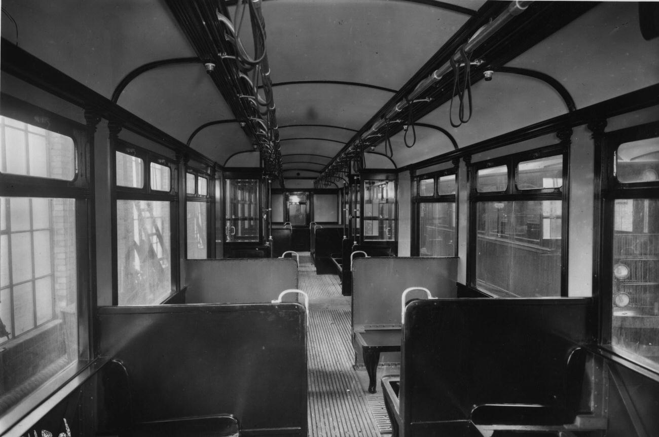 The interior of a District Line Underground railway carriage in London, 1911