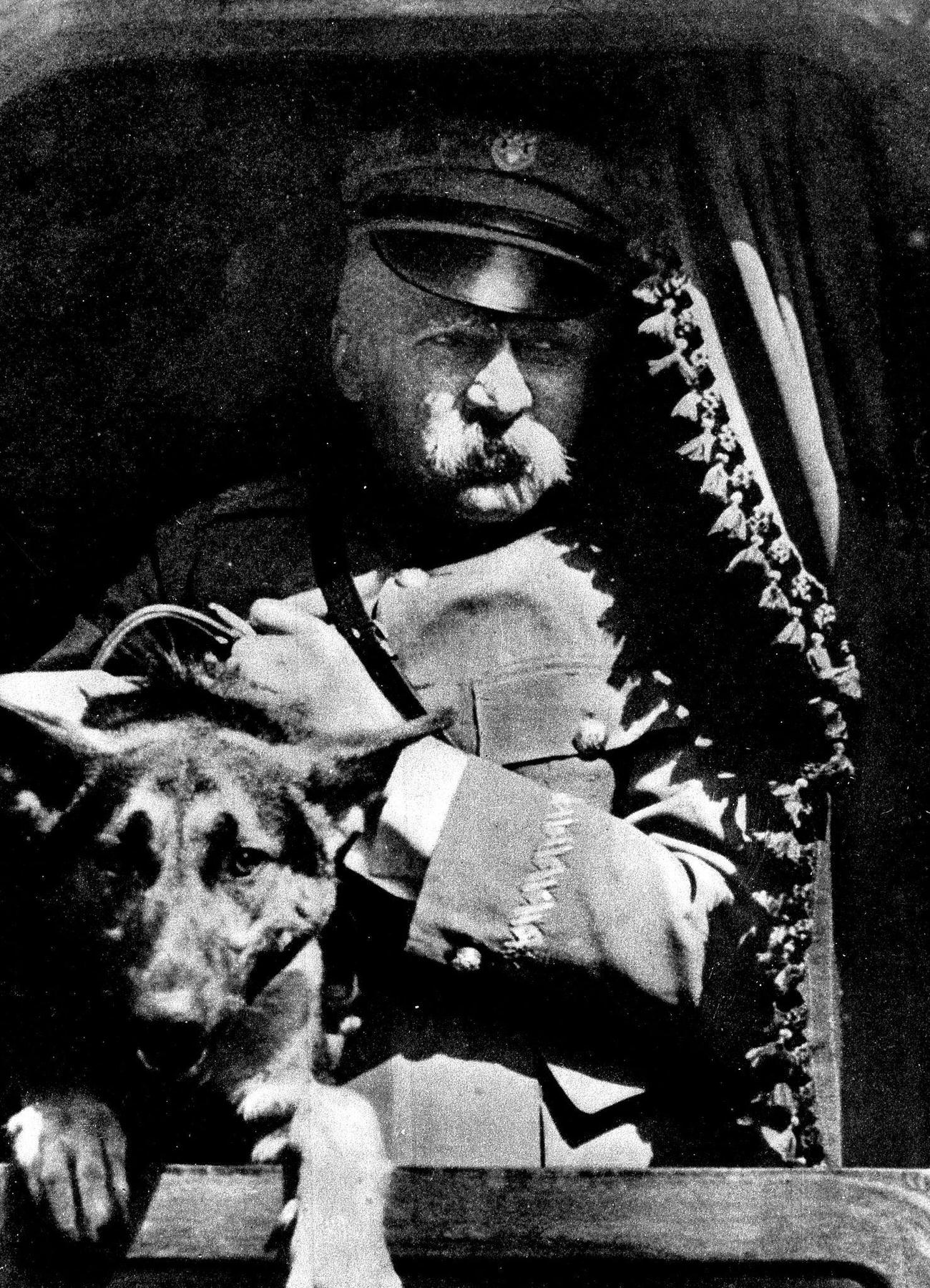 Jozef Pilsudski Jozef. Officer and politician, Poland Portrait in uniform, with his German shepherd dog in a train