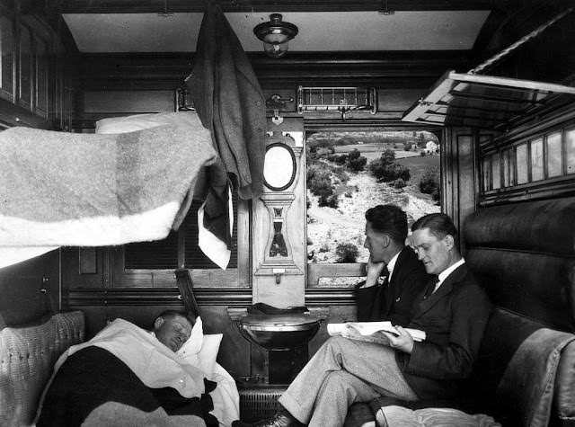 Two man reading while other sleeping, 1924
