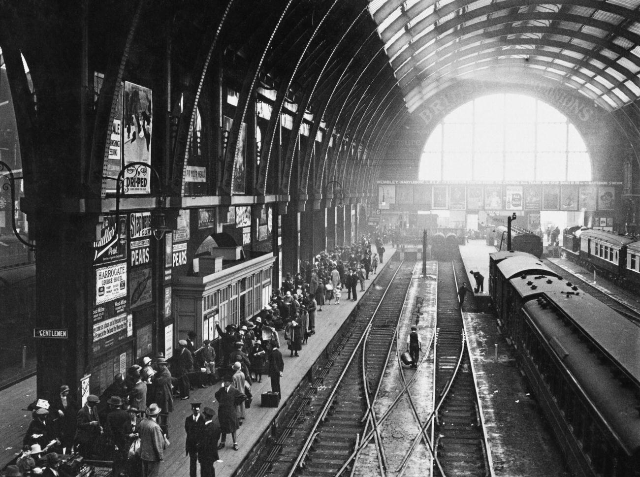 Holiday crowds at King's Cross railway station, London, August 1925.