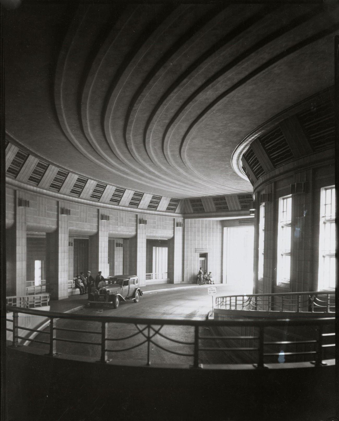 View of the taxi and passenger drop-off ramp at Cincinnati Union Terminal, Cincinnati, Ohio, 1933.