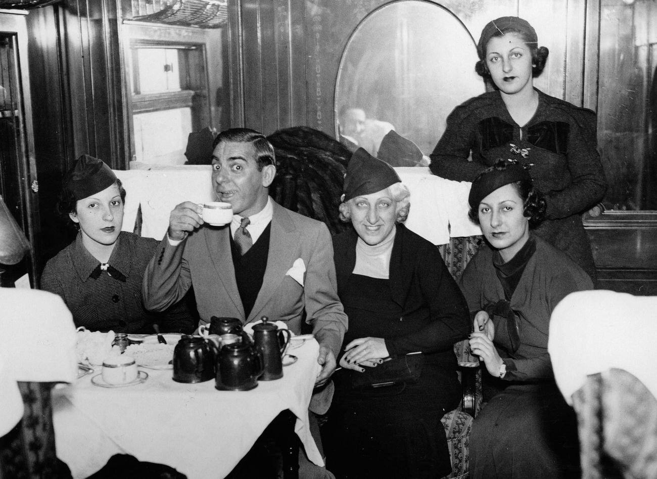 Author Eddie Cantor in the train compartment with his wife and three of his daughters, 1930