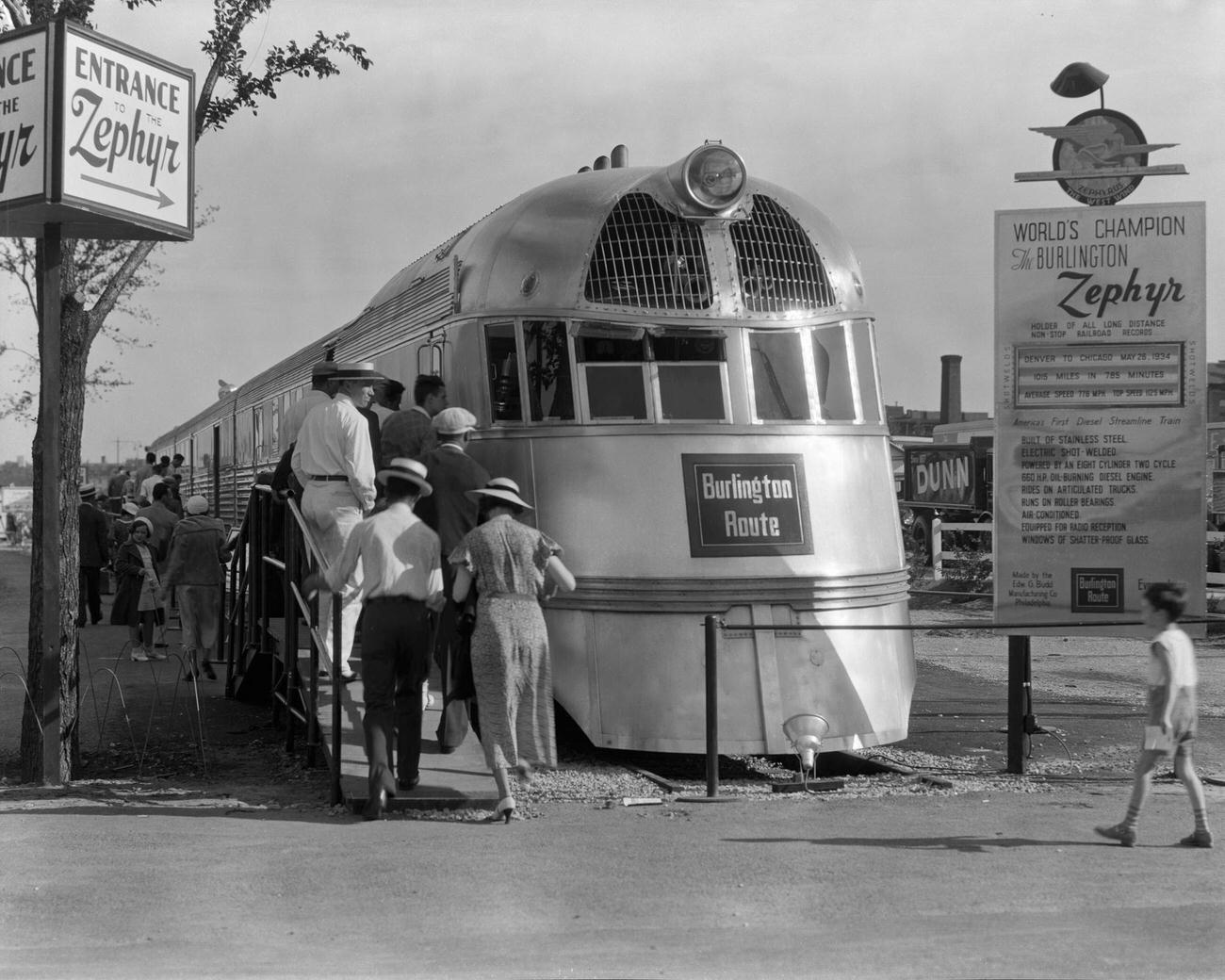 View of people as they line up to view the Burlington Zephyr (which was later renamed the Pioneer Zephyr) at the Century of Progress International Exposition (or the Chicago World's Fair) Chicago, Illinois, 1934.