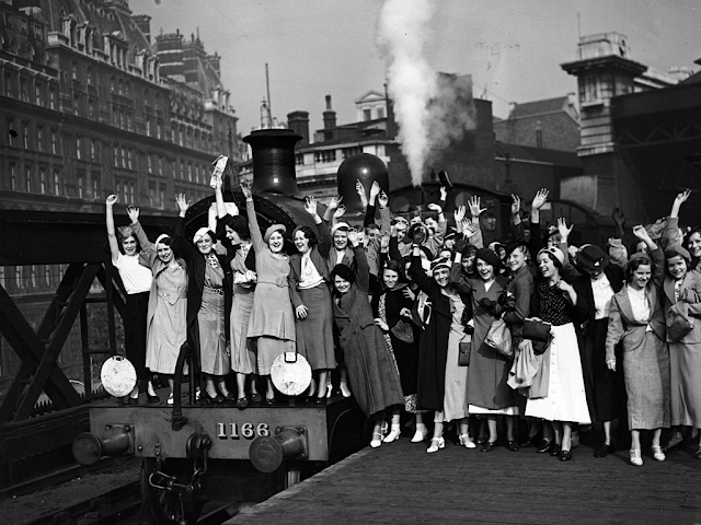 Traveling was an event. Employees of Messrs Carreras waving from the platform prior to departure from Charing Cross Station, London, in 1935.