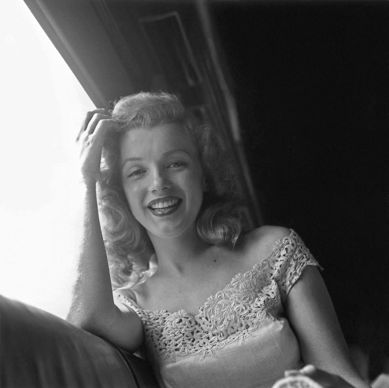 Marilyn Monroe riding on a train from New York City to Warrensburg, New York in June 1949.