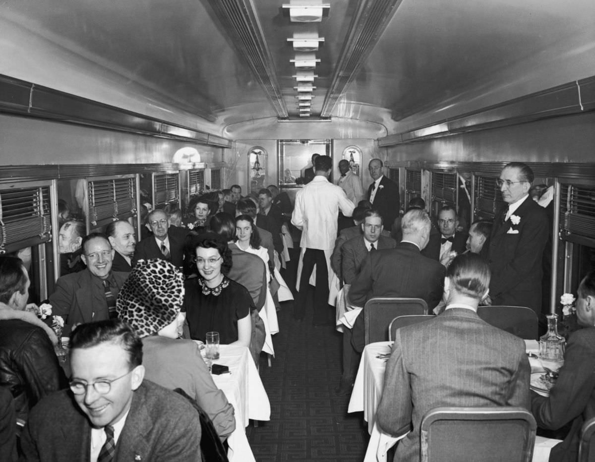 Interior view of a crowded restaurant car, 1940.