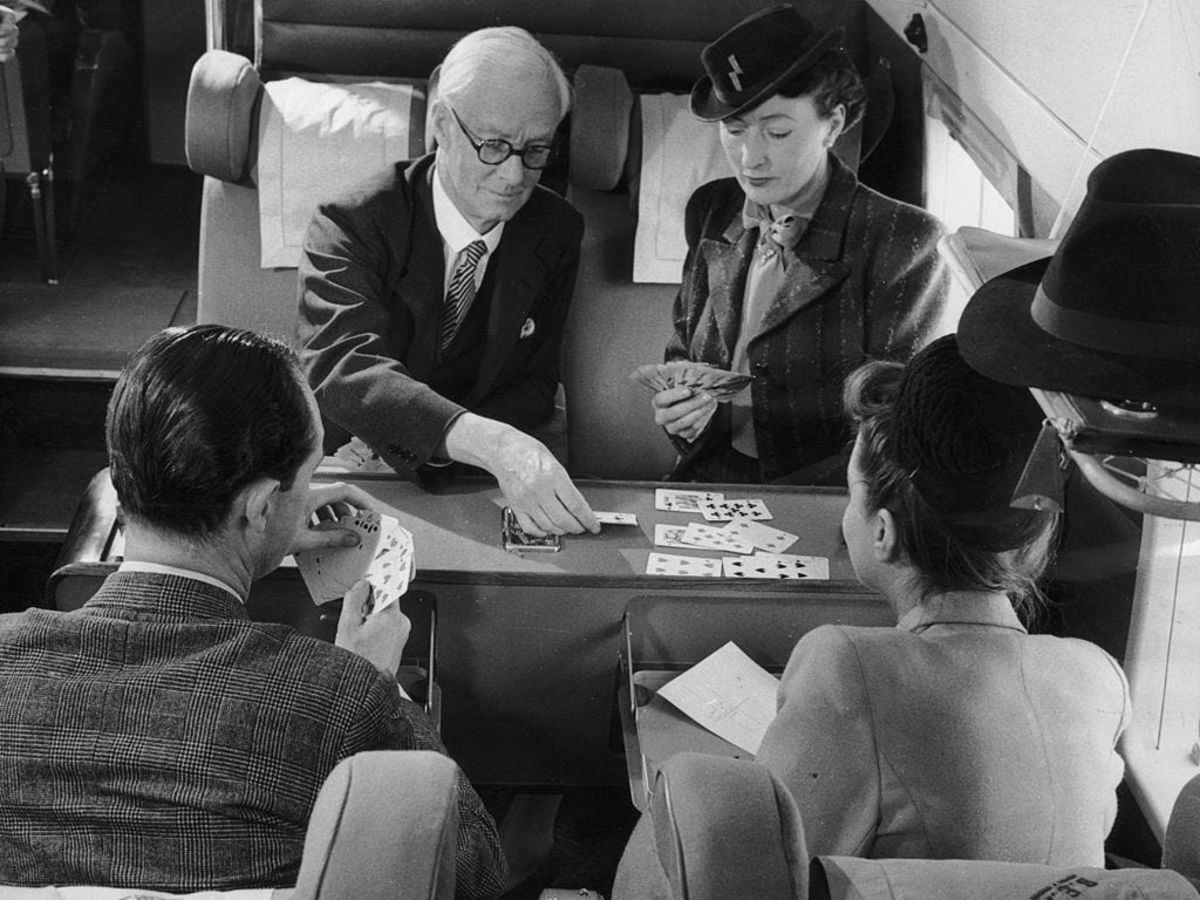 Passengers in a BEA Vickers Viking while away the time with a game of cards, 1947.