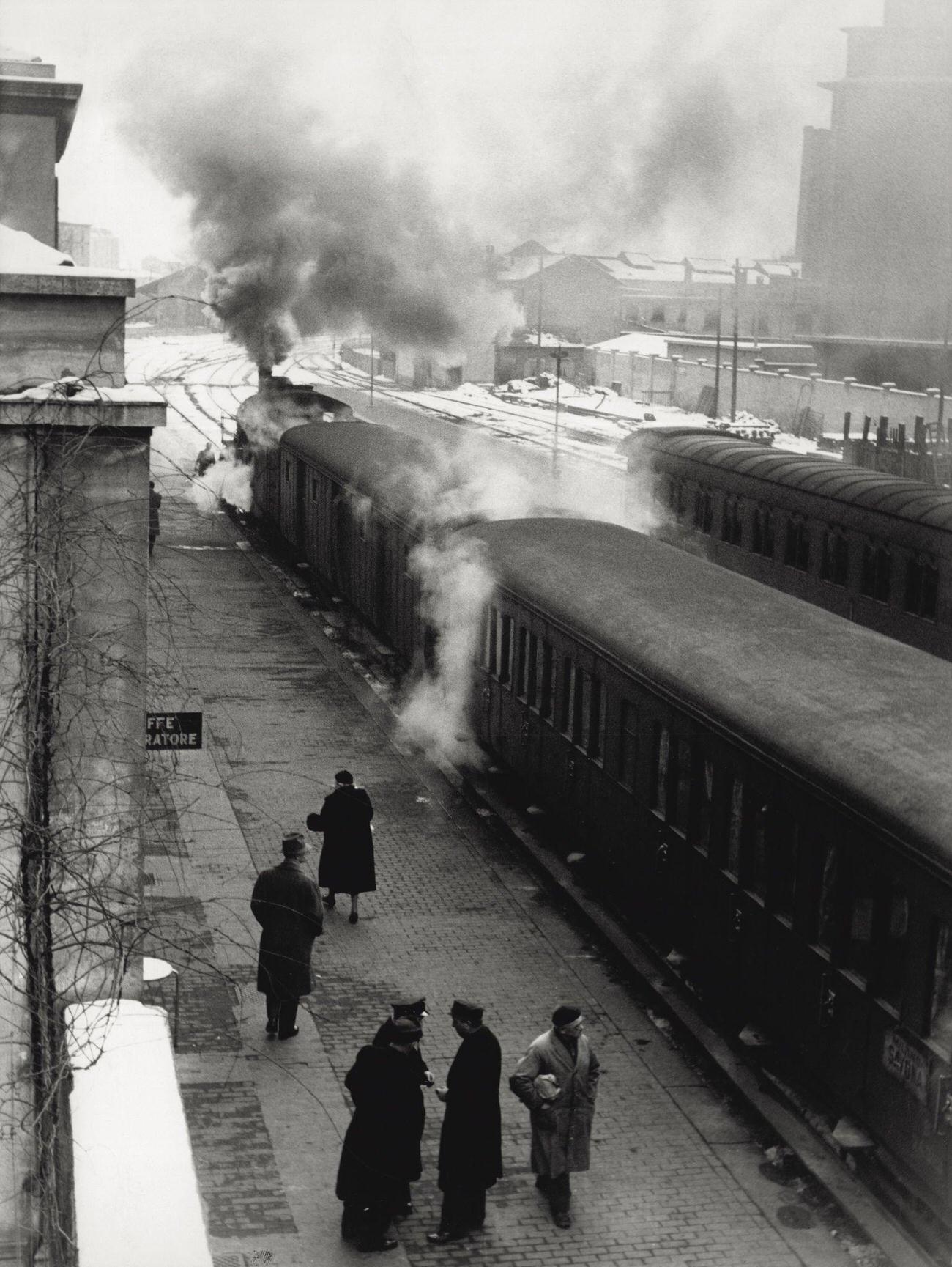 View of the steam trains at the railway station of Porta Genova after a snow fall, Milan, 1950