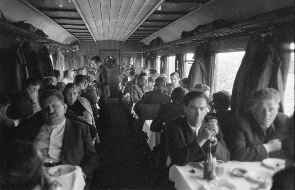 Crowded dining car aboard the Simplon Orient Express train, 1950.