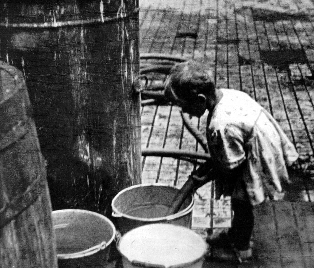 A young girl collecting water.