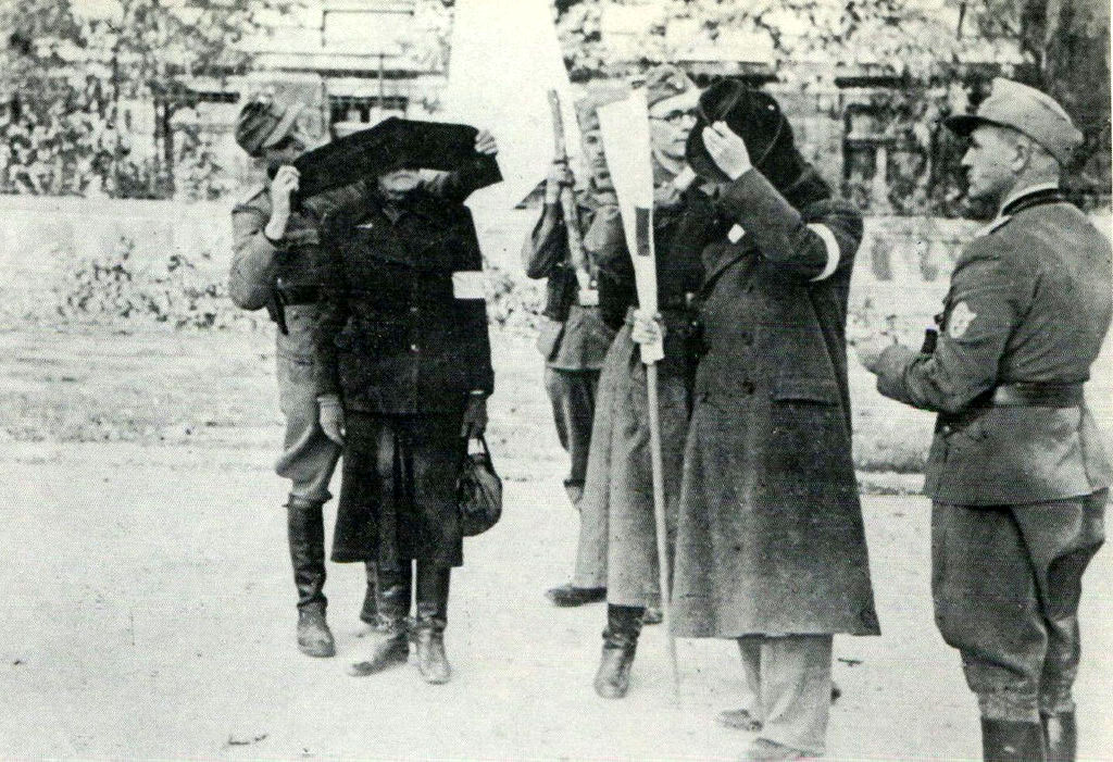Members of the Polish Red Cross are blindfolded before being allowed to cross German lines for negotiations about allowing civilians to evacuate Warsaw.