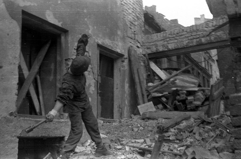A Polish partisan from Anna company of the Gustaw battalion, throwing a grenade towards German positions.