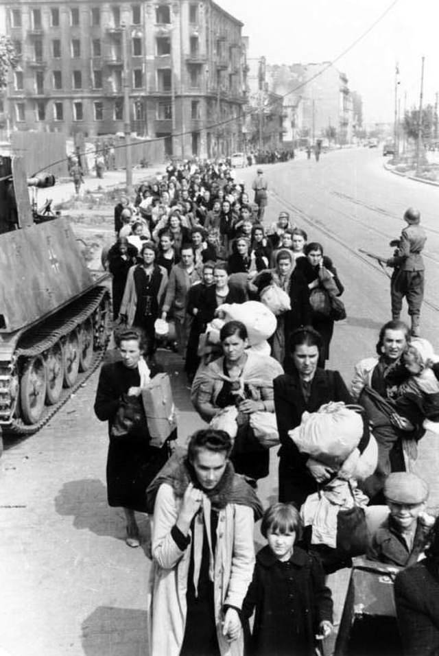 Residents of the Wola district being marched down Wolska Street after being expelled from their homes.