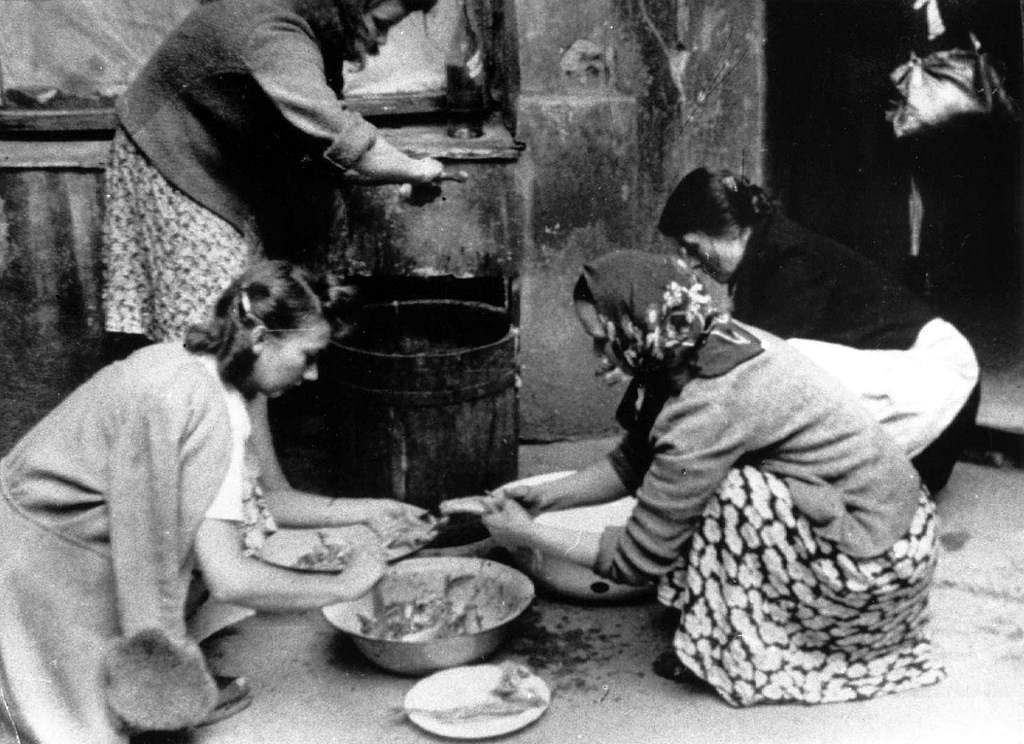 Women preparing food.