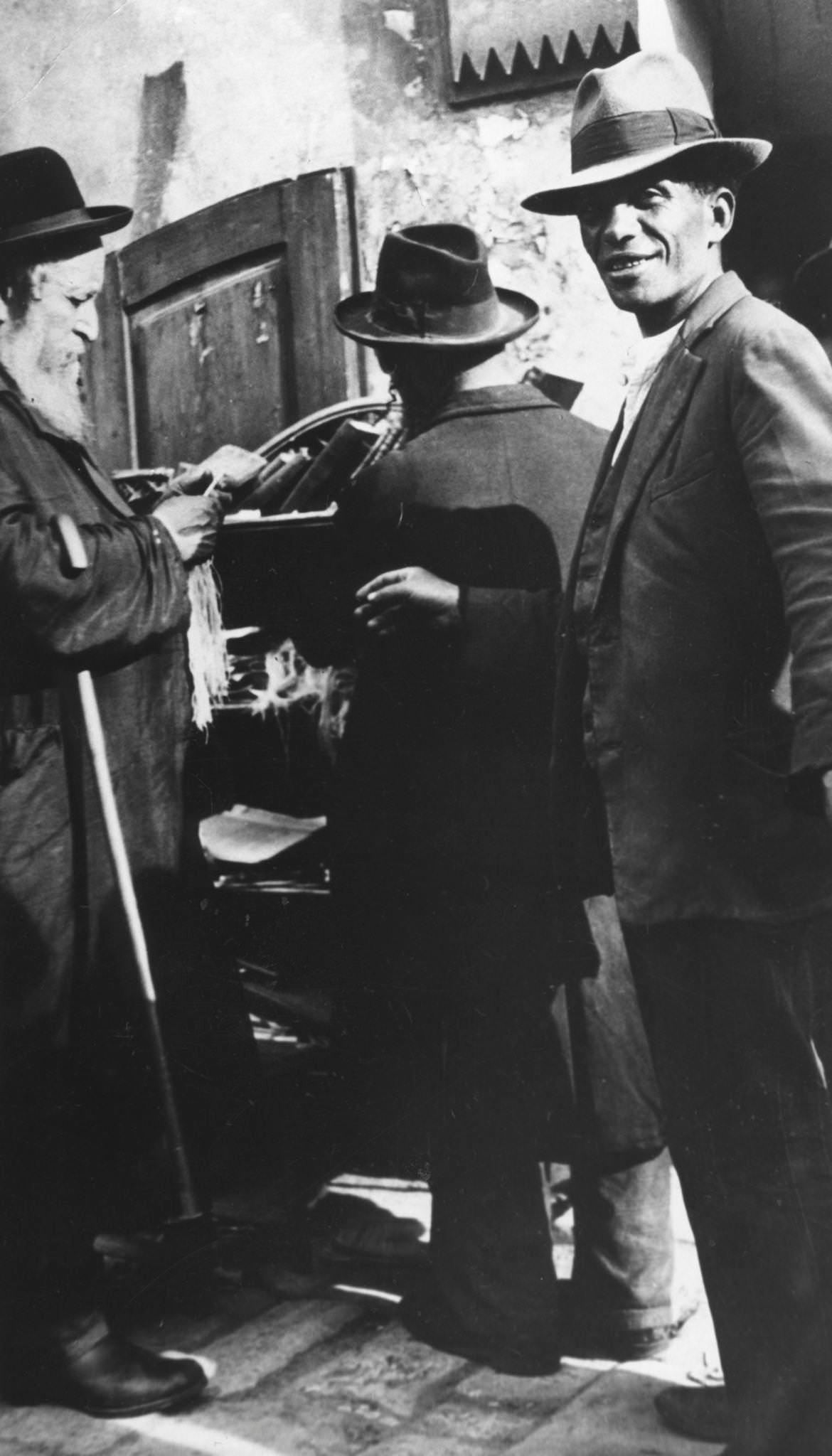 Examining tzitzit, Lemberg Ghetto, USSR, 1941