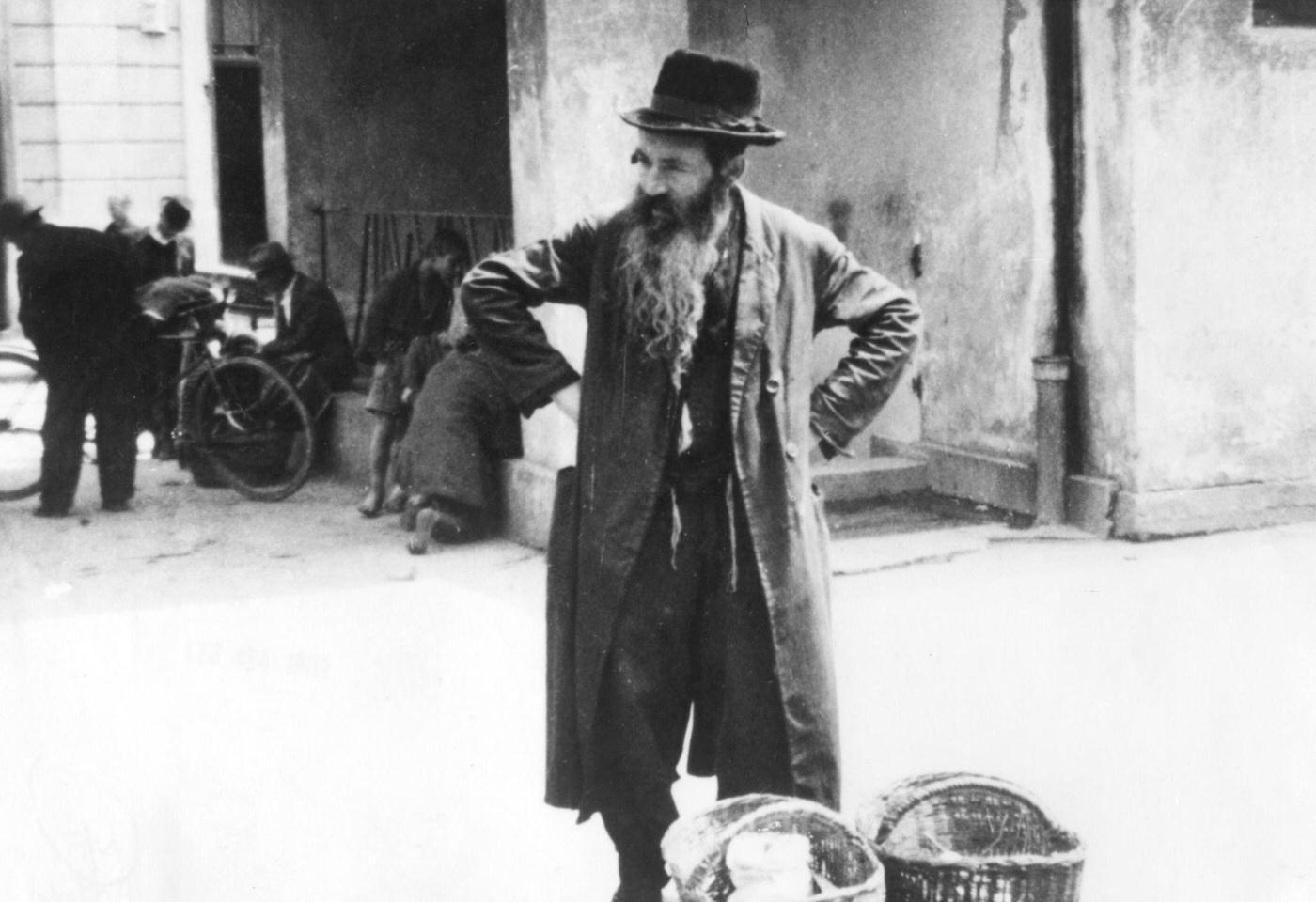 Jewish peddler selling potatoes, Warsaw Ghetto, Poland, 1942