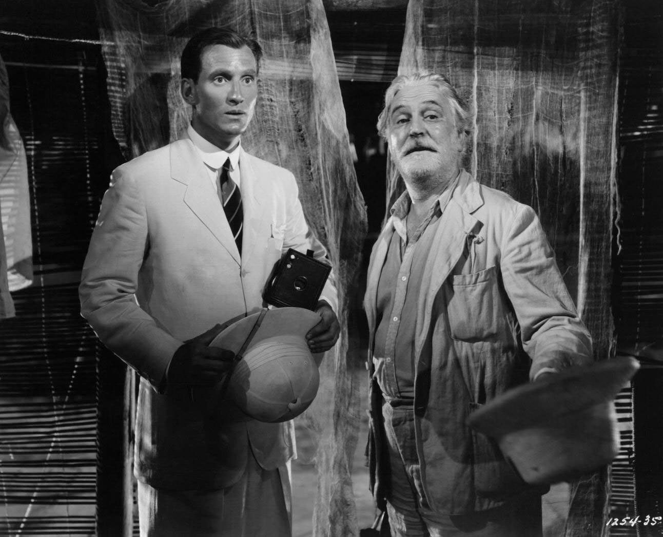 Richard Ainley is shocked as Frank Morgan presents Africa to him in a scene from the film 'White Cargo', 1942.