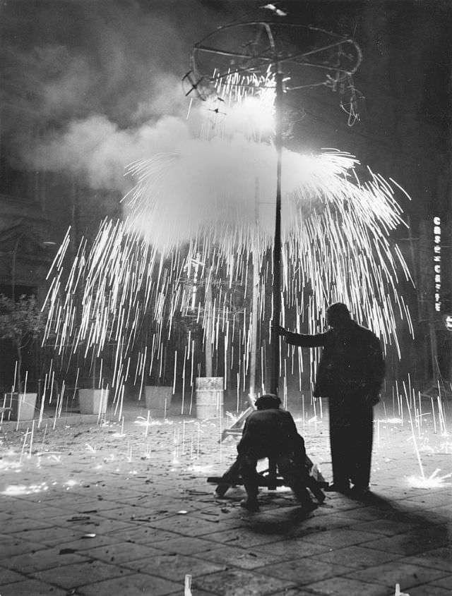 Men lighting fireworks, Sicily, 1950s. (Mario De Biasi)