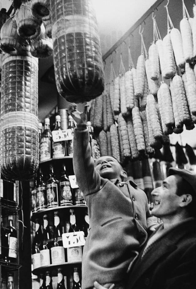 Father and son shopping for Christmas, Milan, 1958.