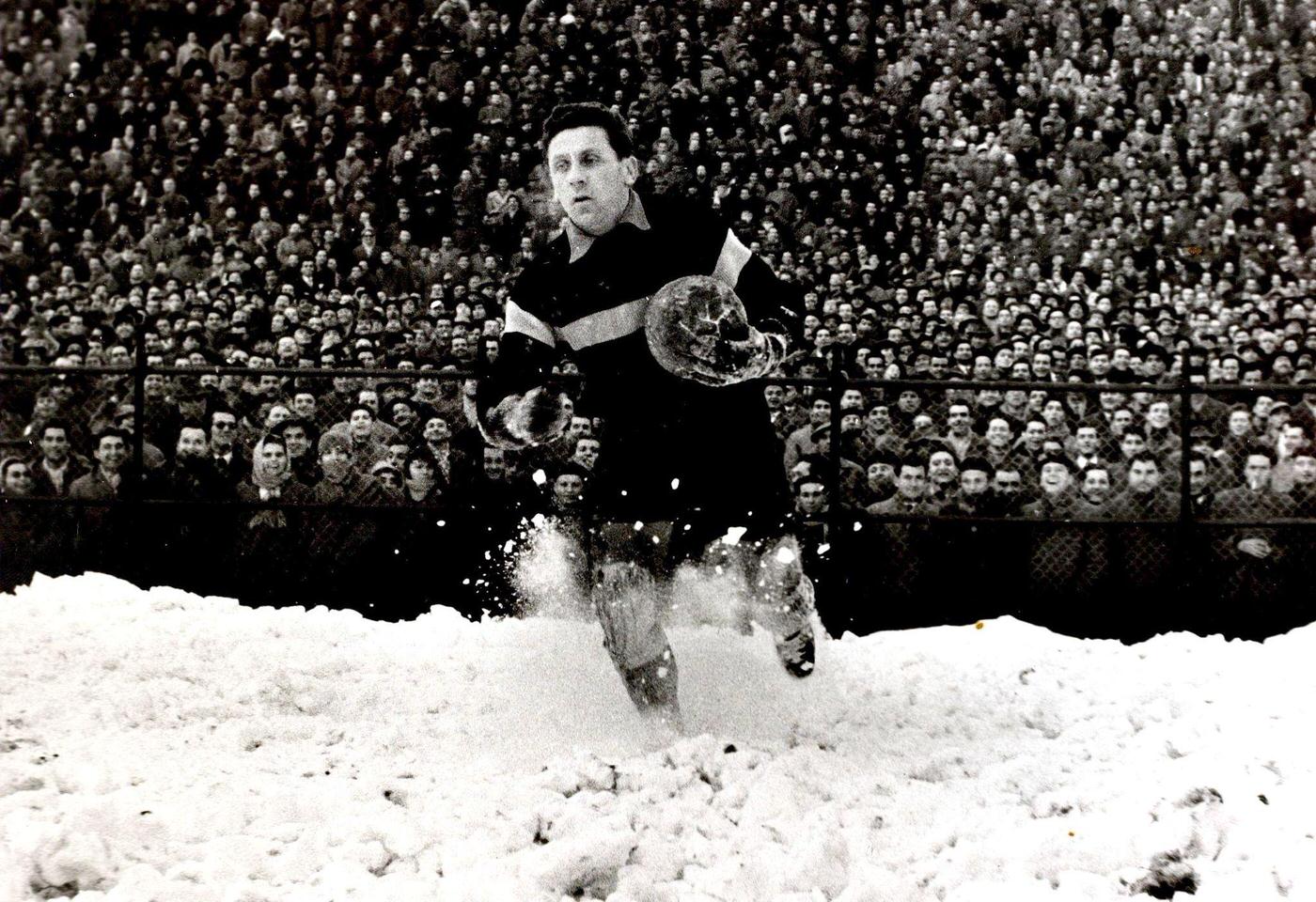Italy v France, A picture of the French goalkeeper Remetter as he retrieves the ball from the snow behind his goal