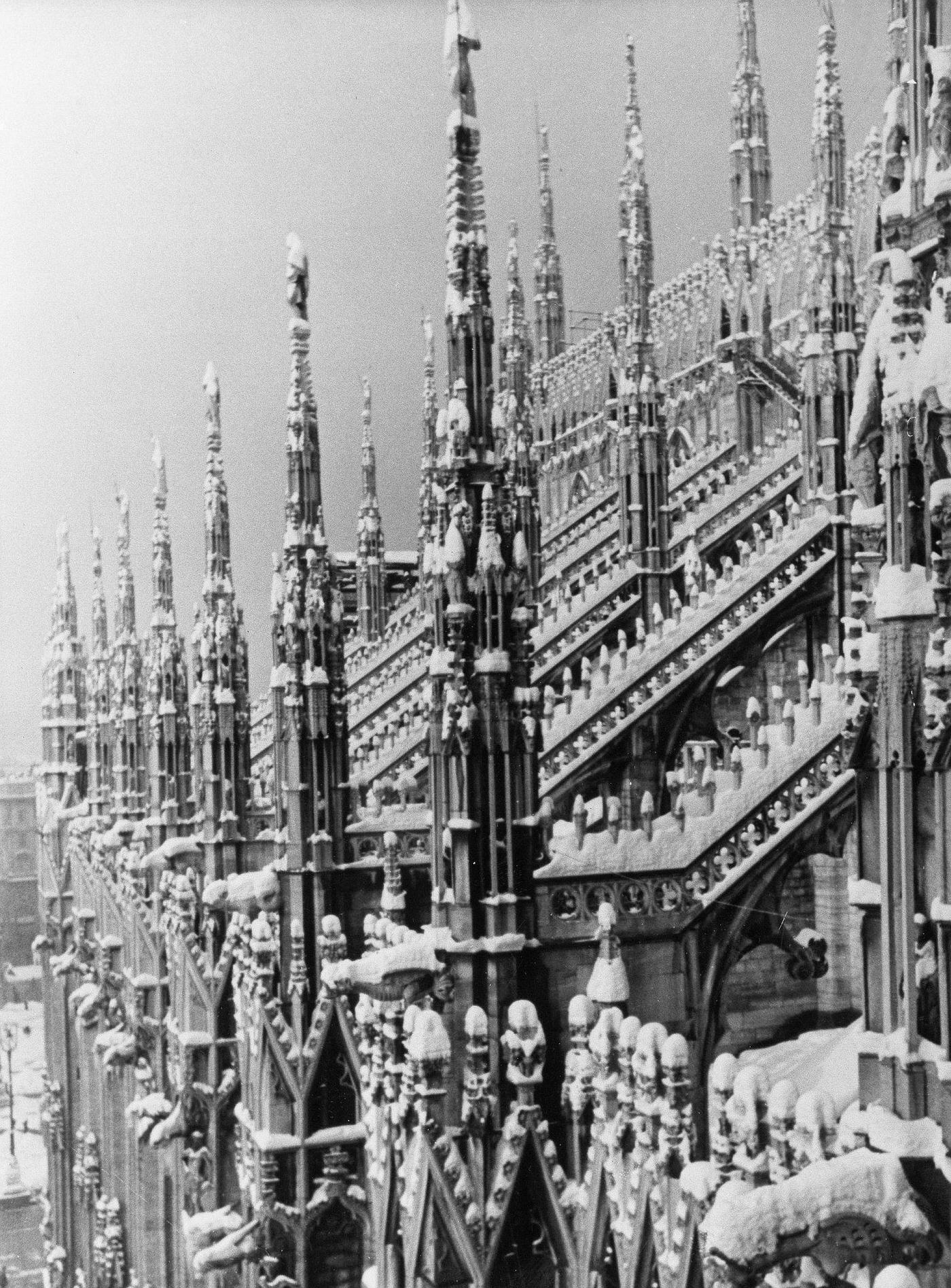 Pinnacles and flying buttresses of Milan Cathedral in the winter in Italy, 1934
