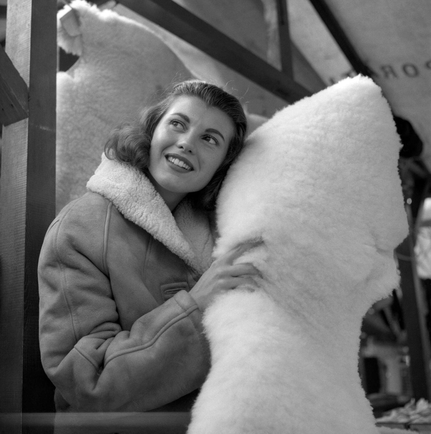 Miss United Kingdom, 23 year old Hilda Fairclough, who is spending the winter selling sheepskins for her father in Morecambe Market.