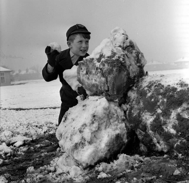 A boy about to throw his snowball, 1961.
