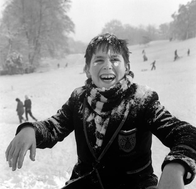 Little boy playing in the snow on Hampstead Heath, 1962.