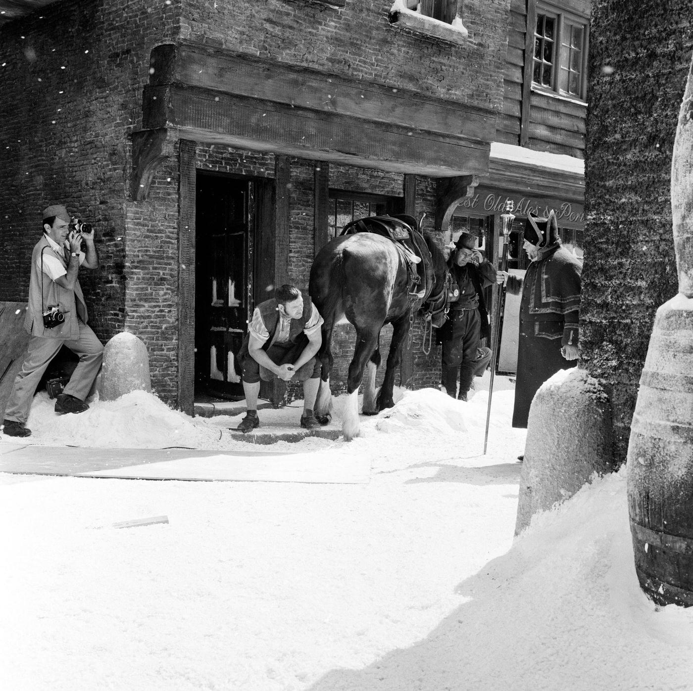 Filming of Oliver! at Shepperton studios: the scene which should have been shot in mid winter was being shot in August with a ton of featherlight polystyrene strewn