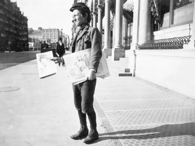 Newspaper vendor.