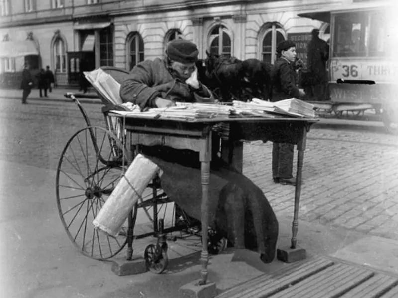 Newspaper vendor.