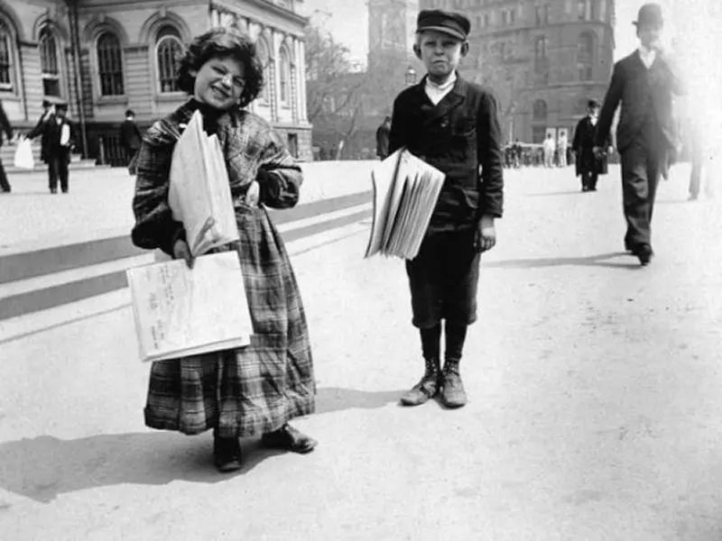 Newsgirl and newsboy.