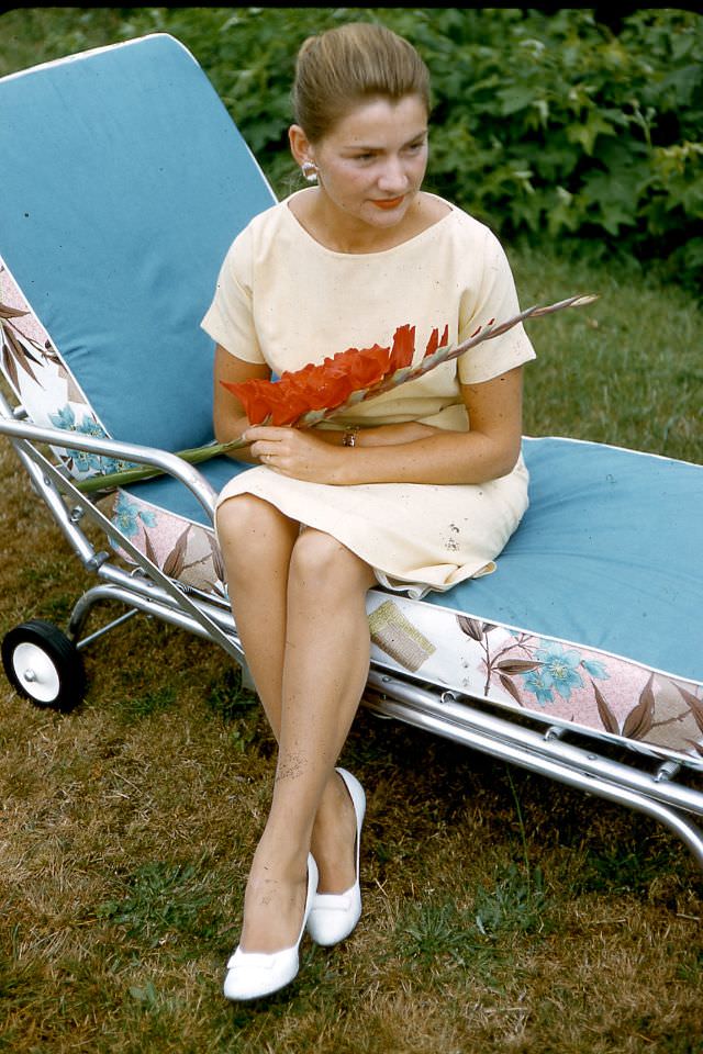 Arlene Smith with gladiollas, 1959