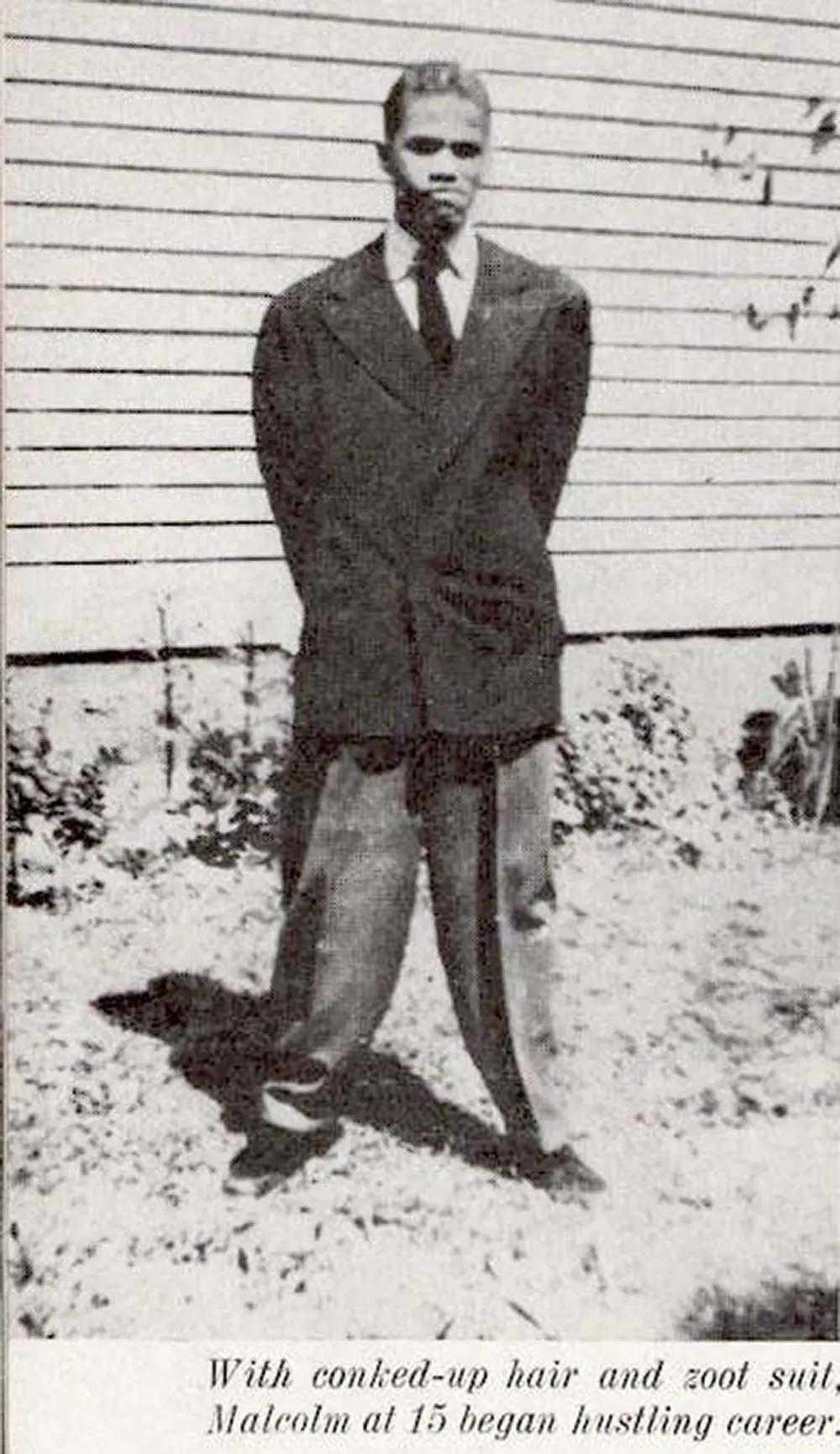 Malcolm X wearing a zoot suit.