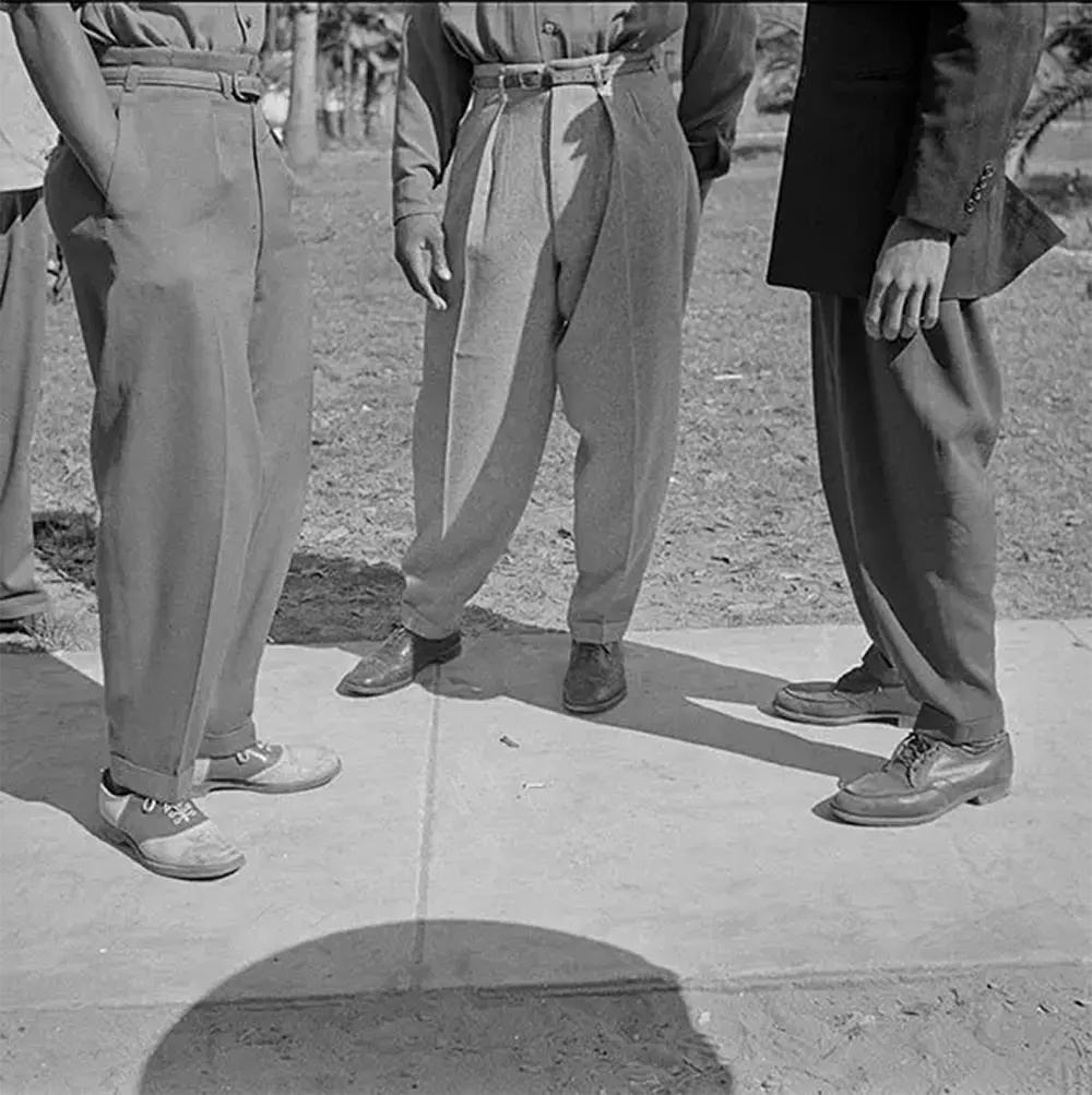 Zoot suit pants legs were wide and tapered at the ankles. The noted photographer Gordon Parks captured this image in Daytona Beach, Florida.