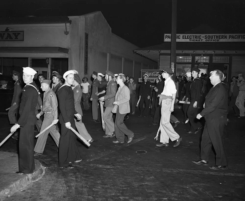 Armed with clubs, pipes and bottles, this self-appointed posse of uniformed men looked for zoot suit youths when the Navy Shore Patrol stepped in and broke it up on June 11, 1943