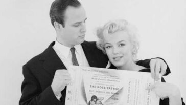Marlon Brando and Marilyn Monroe holding ticket
